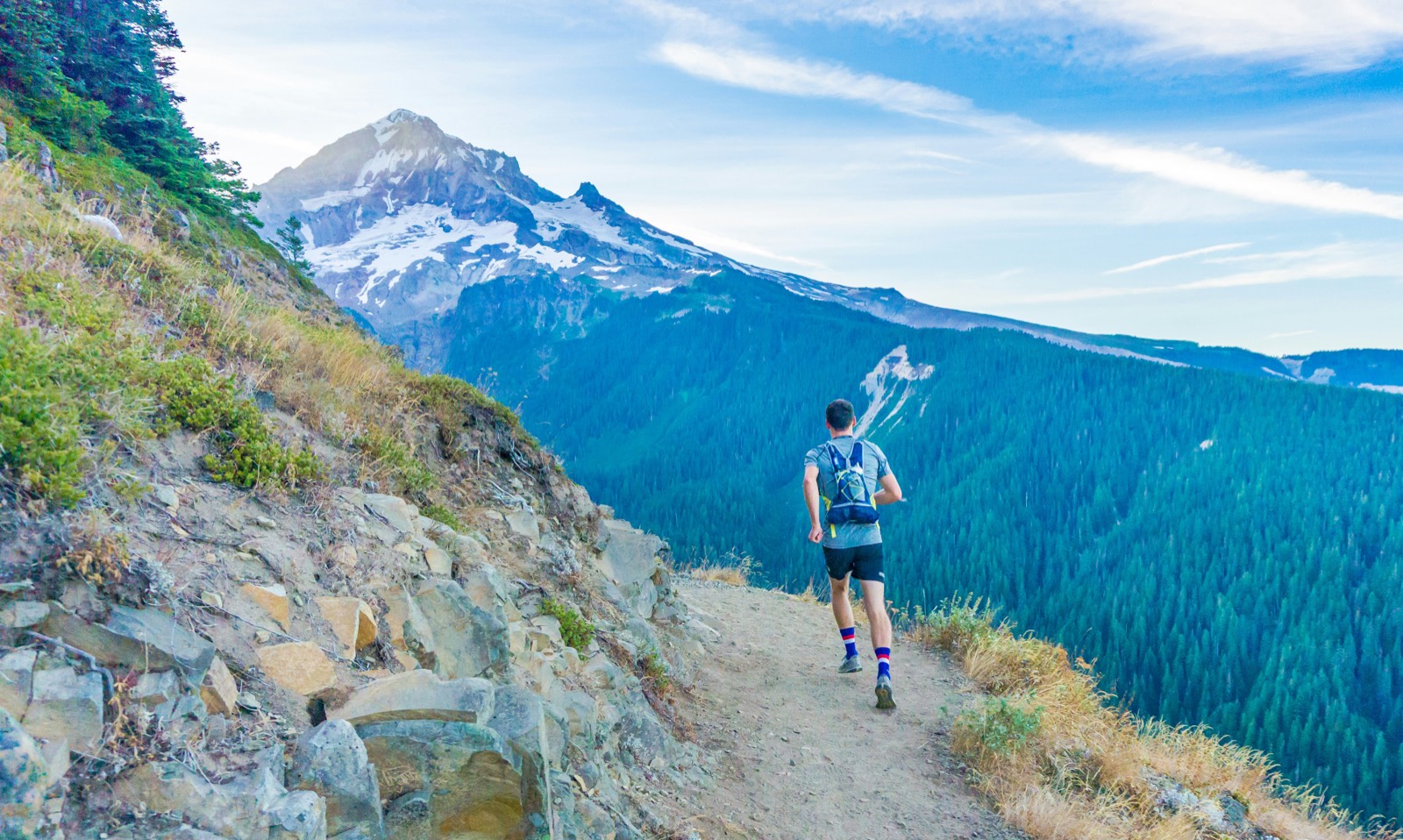 Trail runner on mountain ridge